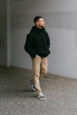 Dark Green Canvas Low Top Sneakers Outfits For Men: This combo of a black hoodie and khaki corduroy chinos is uber versatile and creates instant appeal. When it comes to footwear, this look pairs nicely with dark green canvas low top sneakers.