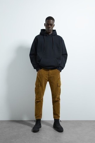 https://cdn.lookastic.com/looks/black-hoodie-brown-cargo-pants-black-canvas-work-boots-large-92286.jpg