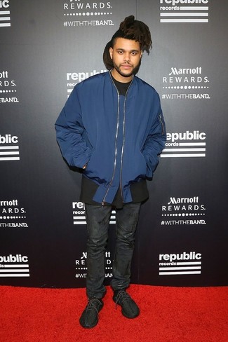 The Weeknd wearing Black Athletic Shoes, Black Leather Jeans, Black Crew-neck T-shirt, Navy Bomber Jacket