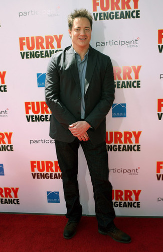 Brendan Fraser wearing Dark Brown Leather Derby Shoes, Black Jeans, Blue Chambray Long Sleeve Shirt, Charcoal Blazer
