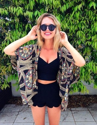 Black Shorts Outfits For Women: When comfort is the priority, this combo of a black print kimono and black shorts is a winner.