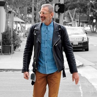 Go for a straightforward but casually stylish ensemble pairing a black leather biker jacket and tobacco chinos.