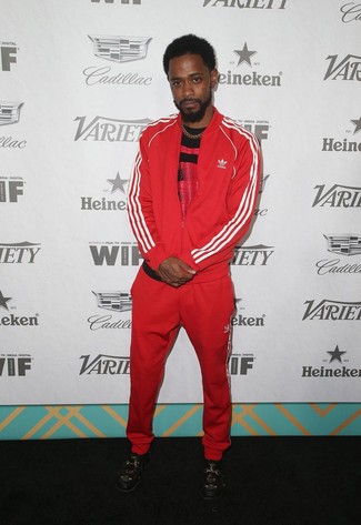 Lakeith Stanfield wearing Black Embroidered Leather Loafers, Red Track Suit, Red and Black Print Crew-neck T-shirt