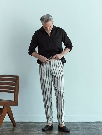 1200+ Outfits For Men After 50: A black long sleeve shirt and white and black vertical striped chinos have become a must-have combination for many sartorially savvy gentlemen. Go ahead and introduce black leather loafers to this ensemble for an extra touch of sophistication. A good getup to make you a sharp gentleman over 50, rather than just a gentleman over 50.