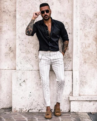 White and Black Vertical Striped Chinos Outfits: Why not wear a black long sleeve shirt with white and black vertical striped chinos? Both of these pieces are very comfortable and will look cool when teamed together. Shake up this getup by rounding off with tan suede tassel loafers.