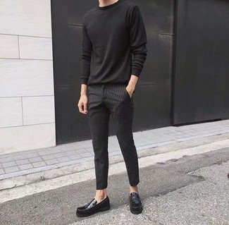 Black Vertical Striped Chinos Outfits: This combo of a black long sleeve t-shirt and black vertical striped chinos is proof that a pared down off-duty outfit doesn't have to be boring. Take a more refined approach with footwear and introduce a pair of black leather loafers to the equation.