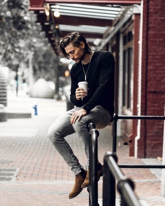 Black Long Sleeve T-Shirt with Brown Suede Chelsea Boots Outfits For Men: Combining a black long sleeve t-shirt and grey jeans will prove your skills in men's fashion even on weekend days. Class up this look with a pair of brown suede chelsea boots.