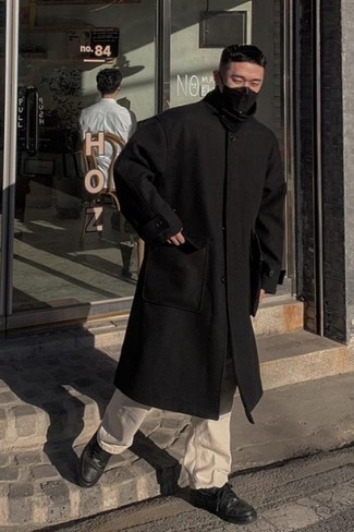 Black Overcoat Outfits: The best choice for effortlessly classic menswear style? A black overcoat with beige chinos. Add a different twist to an otherwise mostly classic outfit by sporting black leather low top sneakers.