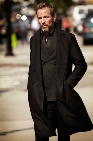 A black overcoat and black jeans are totally worth adding to your list of essential menswear pieces.