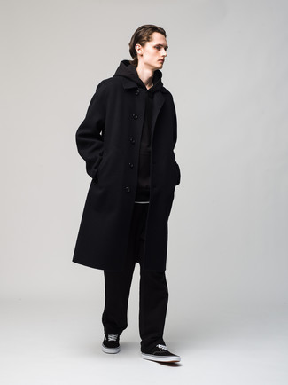 Men's Outfits 2022: This pairing of a black overcoat and black chinos is hard proof that a safe outfit doesn't have to be boring. For something more on the daring side to finish off this outfit, complement this look with black and white canvas low top sneakers.