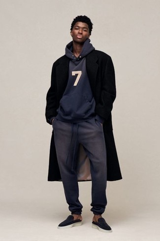 Navy Track Suit Outfits For Men: For a casually stylish getup, consider teaming a navy track suit with a black overcoat — these two pieces fit really cool together. Up the ante of your ensemble by wearing navy suede loafers.