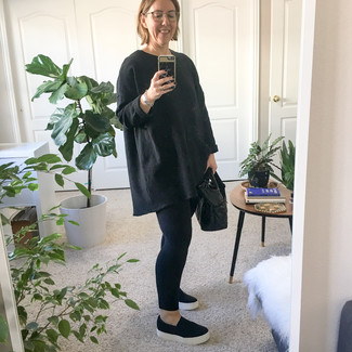 Black Slip-on Sneakers Outfits For Women: For a laid-back getup, choose a black oversized sweater and black leggings — these items play beautifully together. A chic pair of black slip-on sneakers is an effortless way to add a touch of class to your ensemble.