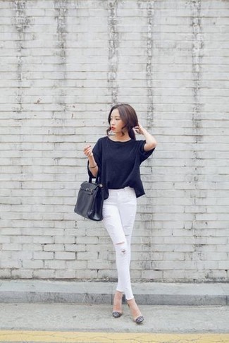 Black Oversized Sweater Outfits: If you like stay-in clothing that's stylish enough to wear out, try this combo of a black oversized sweater and white ripped skinny jeans. You can get a bit experimental on the shoe front and complete this ensemble with a pair of beige leather pumps.
