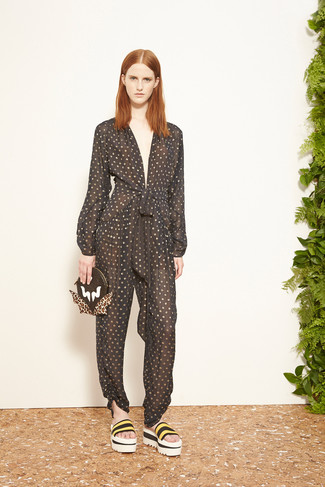 Black Polka Dot Jumpsuit Outfits: Rock a black polka dot jumpsuit for a totaly chic ensemble that's easy to throw together. Give a fun touch to this look with yellow horizontal striped elastic flat sandals.