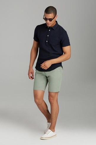Men's Black Polo, Olive Shorts, Beige Canvas Low Top Sneakers, Dark Brown Sunglasses
