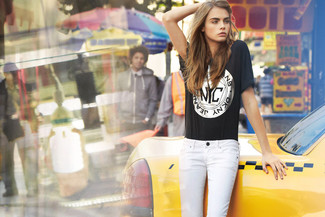 Cara Delevingne wearing Black Print Crew-neck T-shirt, White Skinny Jeans