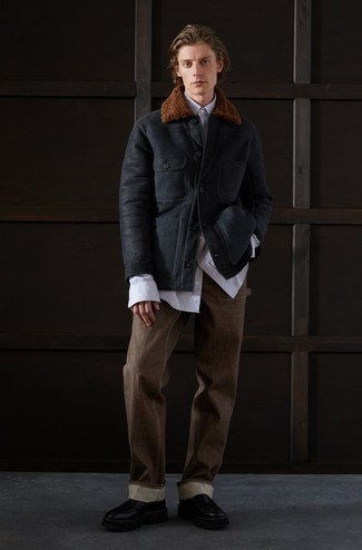 500+ Winter Outfits For Men: Go for a pared down but casual and cool ensemble by teaming a black shearling jacket and dark brown jeans. If you need to easily bump up your getup with footwear, why not complement this outfit with a pair of black leather chelsea boots? If you're looking to stay snug this winter season and look stylish while doing so, this ensemble is basically an essential.