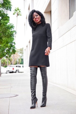 Black Shift Dress Outfits: If you don't take your personal style lightly, go for elegant style in a black shift dress. The whole getup comes together perfectly when you add black leather over the knee boots to the mix.