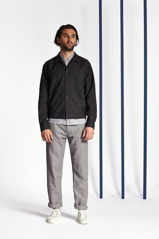 Black Shirt Jacket Outfits For Men: For a casually sleek outfit, pair a black shirt jacket with grey chinos — these two items play pretty good together. Clueless about how to finish? Complete this look with white canvas low top sneakers for a more casual finish.