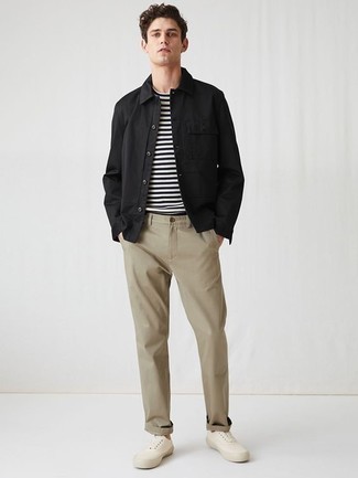 Black Shirt Jacket Outfits For Men: A black shirt jacket looks especially seriously stylish when paired with khaki chinos. Add white canvas low top sneakers to this look to inject a dose of stylish effortlessness into your look.