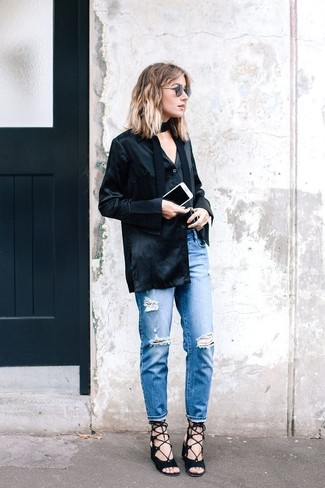 Blue Ripped Jeans Outfits For Women: This combination of a black silk dress shirt and blue ripped jeans combines comfort and efficiency and helps keep it simple yet trendy. A pair of black suede heeled sandals will take your outfit down a whole other path.