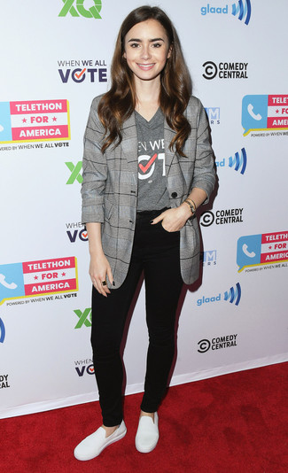 Lily Collins wearing White Leather Slip-on Sneakers, Black Skinny Jeans, Grey Print V-neck T-shirt, Grey Plaid Blazer