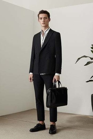 Black Leather Tote Bag Outfits For Men: Extremely dapper and comfortable, this relaxed casual combo of a black suit and a black leather tote bag will provide you with ample styling opportunities. Black leather derby shoes will bring a strong and masculine feel to any look.