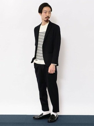 White and Black Horizontal Striped Long Sleeve T-Shirt Outfits For Men: This pairing of a white and black horizontal striped long sleeve t-shirt and a black suit makes for the perfect base for a countless number of on-trend ensembles. Unimpressed with this look? Enter black leather loafers to mix things up.
