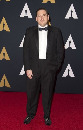 Jonah Hill wearing Black Suit, White Dress Shirt, Black Embroidered Suede Loafers, Black Bow-tie