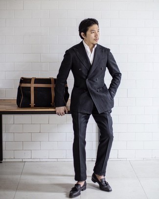 Black Suede Tote Bag Outfits For Men: The styling capabilities of a black suit and a black suede tote bag guarantee they will be on heavy rotation. And if you need to instantly level up this getup with a pair of shoes, complement your look with black leather tassel loafers.