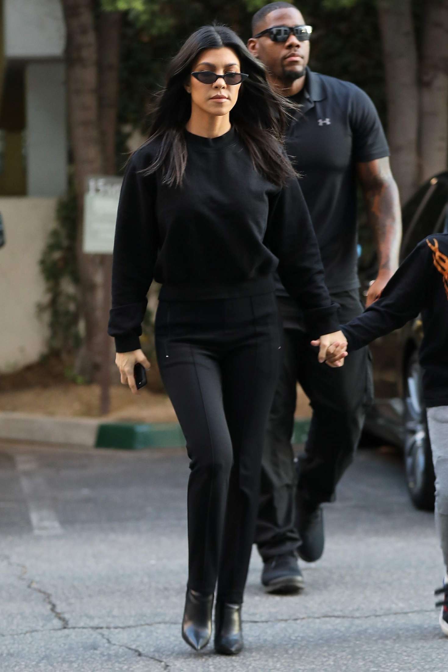 Women's Black Sweatshirt, Black Skinny Pants, Black Leather Ankle Boots,  Black Sunglasses