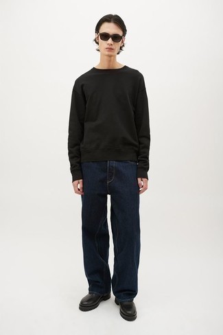 Black Sweatshirt Outfits For Men: Go for a pared down but at the same time casually cool outfit in a black sweatshirt and navy jeans. Clueless about how to finish off this ensemble? Finish off with black leather chelsea boots to spruce it up.