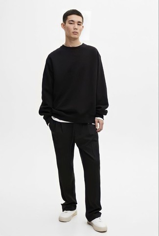 White Canvas Low Top Sneakers Outfits For Men: Putting together a black sweatshirt with black chinos is an on-point option for a casual yet on-trend look. We love how this whole getup comes together thanks to white canvas low top sneakers.