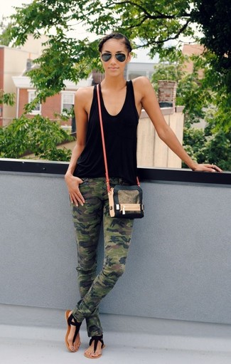 Olive Skinny Jeans Outfits: The combination of a black tank and olive skinny jeans makes for a killer laid-back look. Go ahead and add a pair of black suede thong sandals to the mix for a dressed-down feel.