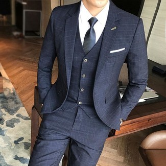 Black Three Piece Suit Outfits: Try teaming a black three piece suit with a white dress shirt and you'll ooze elegance and polish.