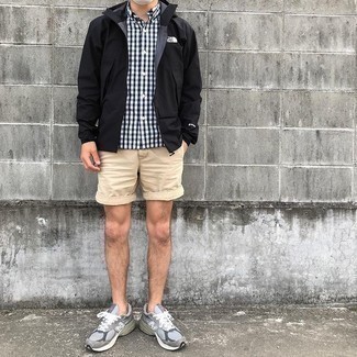 Black Windbreaker Outfits For Men: To don a casual look with a modern twist, go for a black windbreaker and beige shorts. Go off the beaten path and spice up your ensemble by rounding off with a pair of grey athletic shoes.