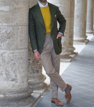 Mustard Cable Sweater Outfits For Men: This elegant combination of a mustard cable sweater and khaki dress pants is a favored choice among the dapper chaps. Our favorite of a countless number of ways to finish this ensemble is with a pair of brown suede tassel loafers.