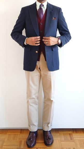 Khaki Dress Pants Outfits For Men: You're looking at the hard proof that a navy blazer and khaki dress pants look amazing when matched together in a polished ensemble for a modern man. The whole look comes together perfectly if you introduce a pair of burgundy leather tassel loafers to the equation.