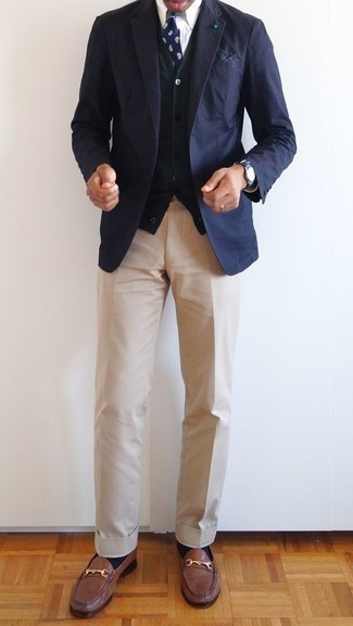 Olive Cardigan with Navy Blazer Outfits For Men: This smart casual combination of a navy blazer and an olive cardigan is extremely easy to throw together without a second thought, helping you look amazing and prepared for anything without spending too much time going through your closet. You can follow the classic route on the shoe front by finishing off with brown leather loafers.