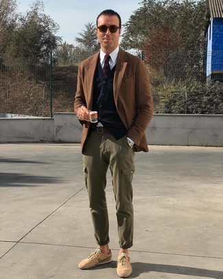 Brown Plaid Wool Blazer Outfits For Men: This combo of a brown plaid wool blazer and olive cargo pants is definitive proof that a safe off-duty outfit doesn't have to be boring. For a more relaxed touch, introduce a pair of tan athletic shoes to the mix.
