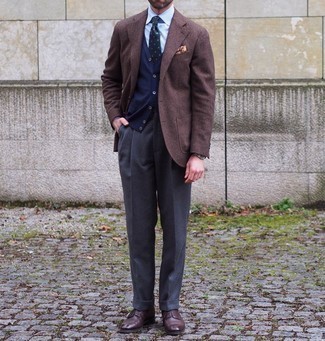 Brown Wool Blazer Outfits For Men: A brown wool blazer and charcoal dress pants are solid players in any gentleman's wardrobe. Introduce dark brown leather derby shoes to the equation and ta-da: the outfit is complete.