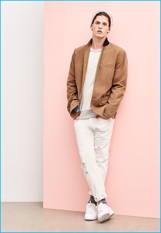 White Ripped Jeans Outfits For Men: Why not pair a tan blazer with white ripped jeans? These two items are very functional and look awesome when paired together. Introduce a pair of white leather low top sneakers to this getup and you're all set looking spectacular.