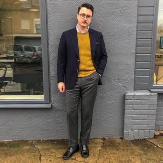 Mustard Crew-neck Sweater Outfits For Men: To look like a proper dandy at all times, consider teaming a mustard crew-neck sweater with charcoal wool dress pants. On the footwear front, this outfit is finished off brilliantly with black leather loafers.