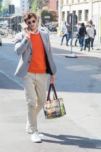 Multi colored Print Canvas Tote Bag Outfits For Men: For a laid-back getup, marry a grey blazer with a multi colored print canvas tote bag — these pieces work perfectly well together. A pair of white canvas low top sneakers will put a different spin on your look.