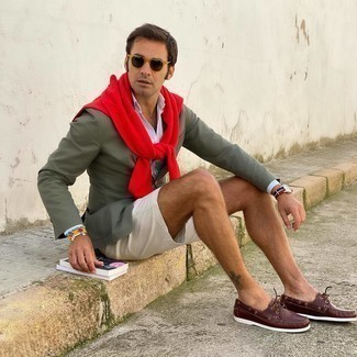 Olive Blazer Outfits For Men: An olive blazer and white shorts are an easy way to introduce some elegance into your day-to-day styling collection. Let your sartorial skills really shine by rounding off this outfit with a pair of brown leather boat shoes.