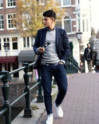 Navy Blazer with Grey Sweater Outfits For Men: Putting together a navy blazer with a grey sweater is an awesome idea for a casually sleek outfit. Add white canvas low top sneakers to the equation to instantly step up the fashion factor of your outfit.