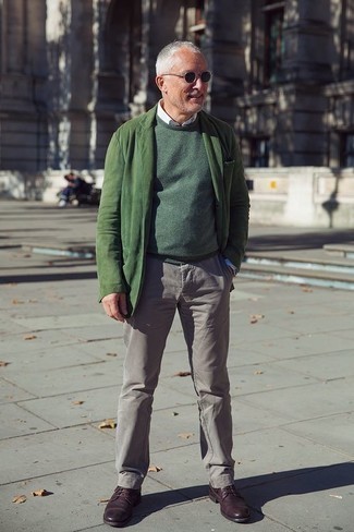 Dark Green Sweater Outfits For Men: Super dapper, this casual pairing of a dark green sweater and grey chinos delivers amazing styling opportunities. You could perhaps get a bit experimental with footwear and lift up this outfit by rocking a pair of burgundy leather derby shoes.