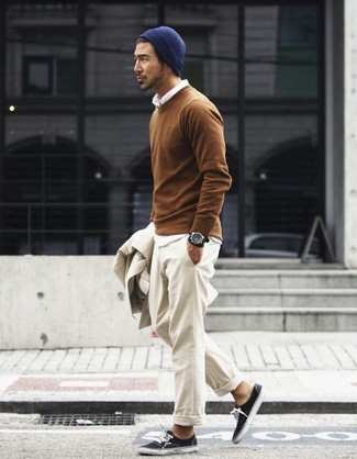 Tobacco Crew-neck Sweater Outfits For Men: Display your chops in menswear styling in this laid-back combination of a tobacco crew-neck sweater and beige chinos. Inject a more relaxed twist into this look with a pair of black low top sneakers.