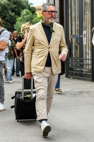 Black Suitcase Outfits For Men: Such must-haves as a tan blazer and a black suitcase are an easy way to introduce some cool into your daily routine. A nice pair of white canvas high top sneakers ties this ensemble together.