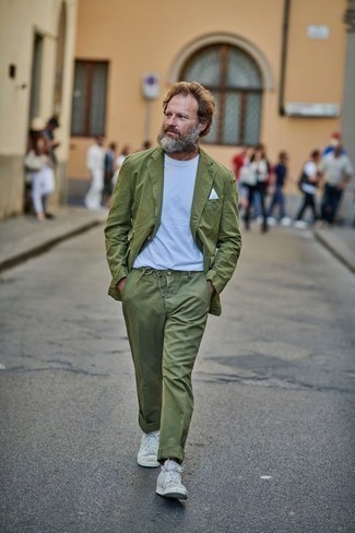 Olive Blazer Outfits For Men: For a casually sleek ensemble, team an olive blazer with olive chinos — these items play really well together. Introduce white canvas high top sneakers to this outfit to make the look more practical.